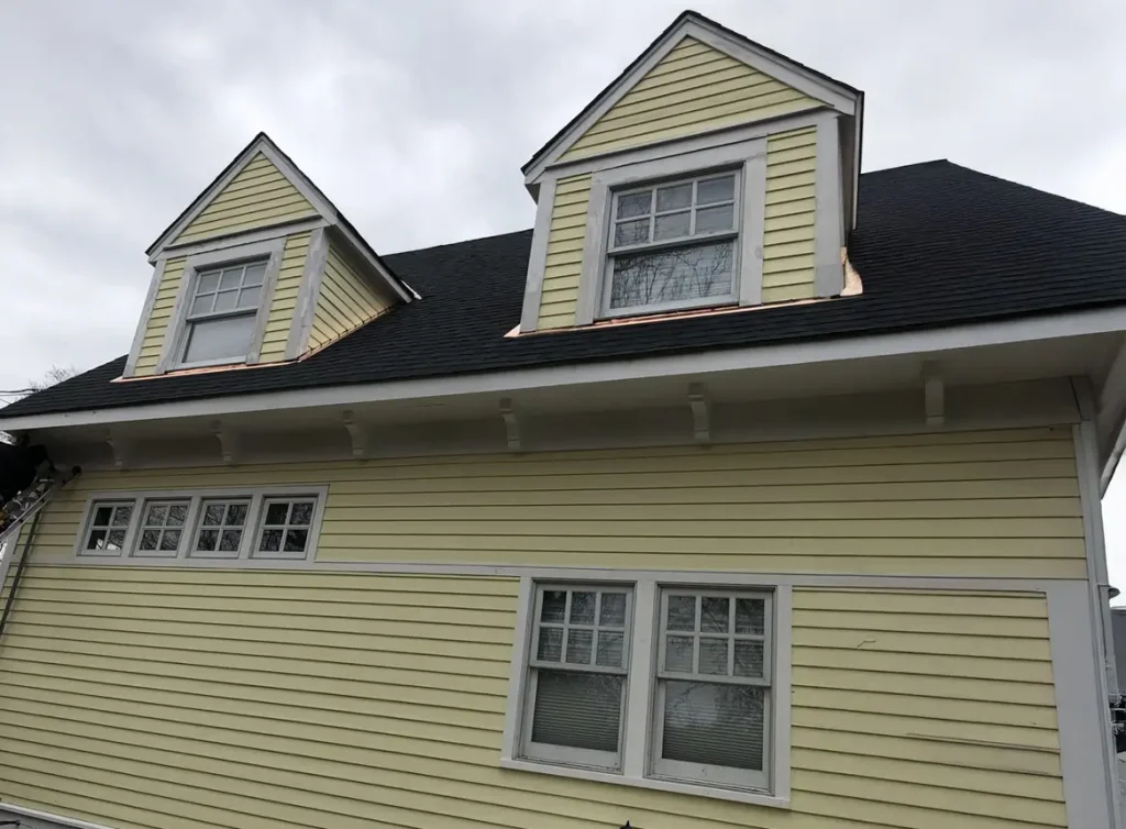 Yellow siding on a two story home.
