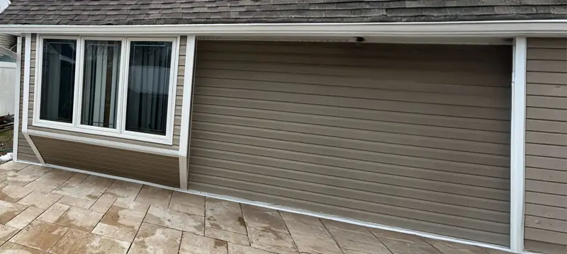 Brown siding on a single story home.